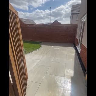 Patio and path alongside a house